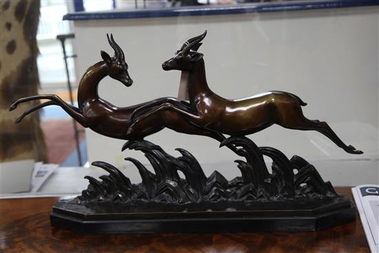 Lucien Charles Alliot (1877-1967) An Art Deco bronze group of two running gazelles, length 29in.